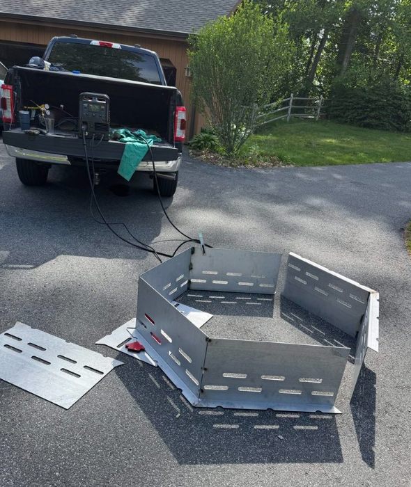 Custom hexagonal fire pit being fabricated on-site